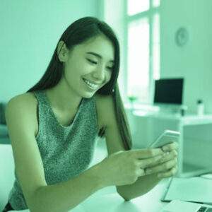 SMS marketing blog post feature image with woman texting via the phone